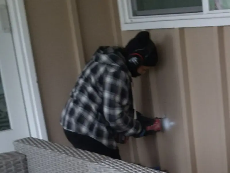 Professional electrician installing an exterior outlet in Cedarville