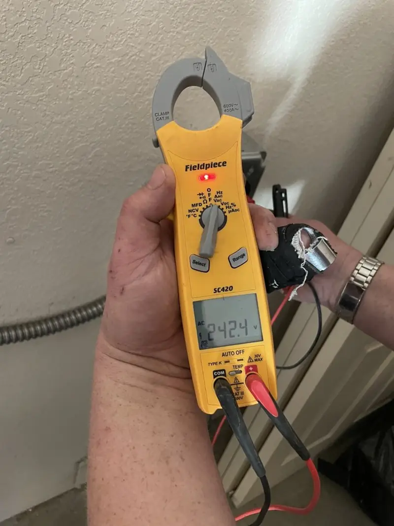 Voltage testing with clamp meter during Circuit Breaker Repair in Cedarville